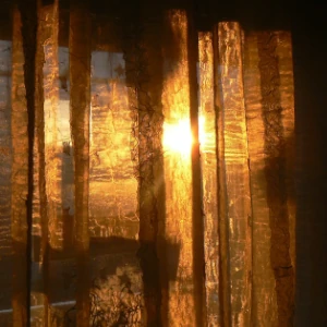 Dawn light peaking through the window curtain