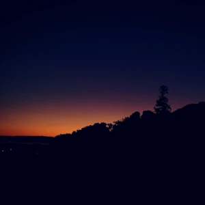 Dawn light peaking through dark terrain