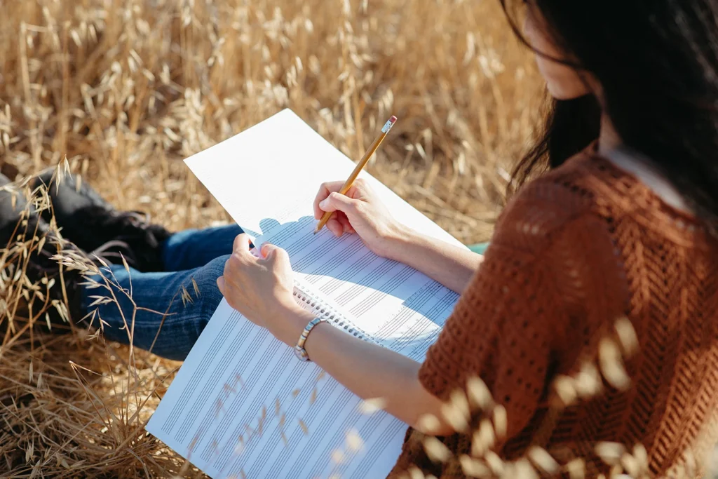 Ellen Tsai composing in a field