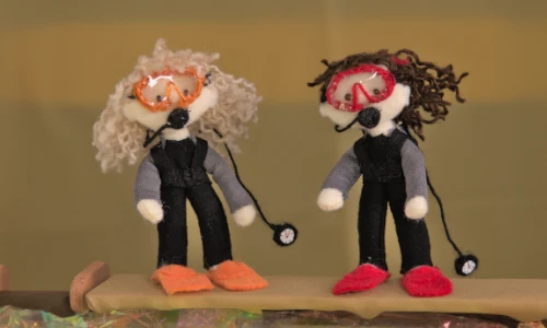 stop-motion image of two diver dolls