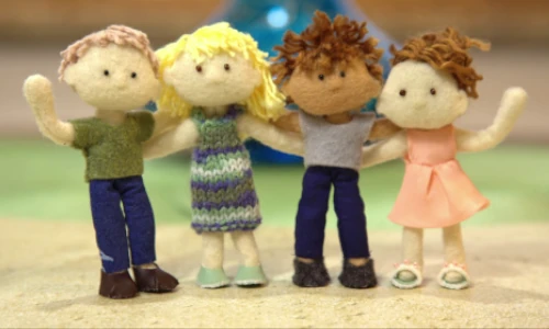 stop-motion image of 4 miniature felt dolls